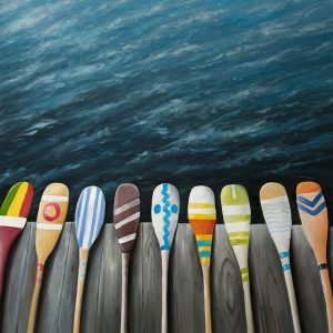 COLORFUL PADDLES ON THE DOCK