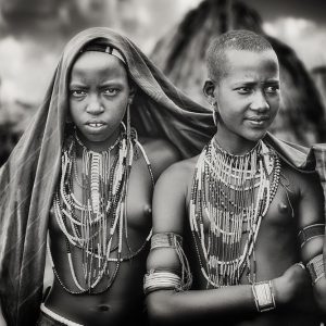 Karo girls sharing a scarf